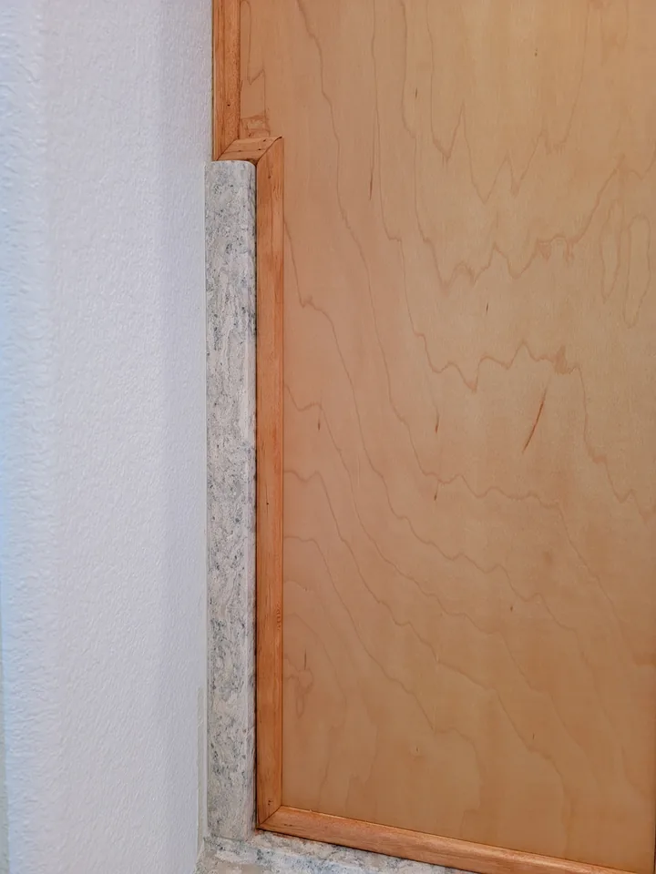Cambria Montgomery side detail where the countertop meets the cabinet and wall
