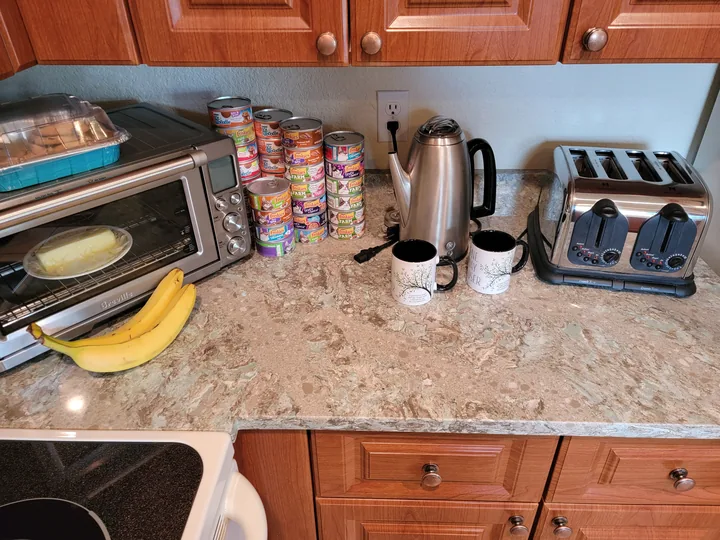 Cambria Kelvin Grove kitchen countertop beside the range and wood cabinets