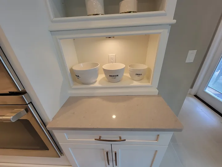 Cambria Seagrove serving countertop below illuminated shelves