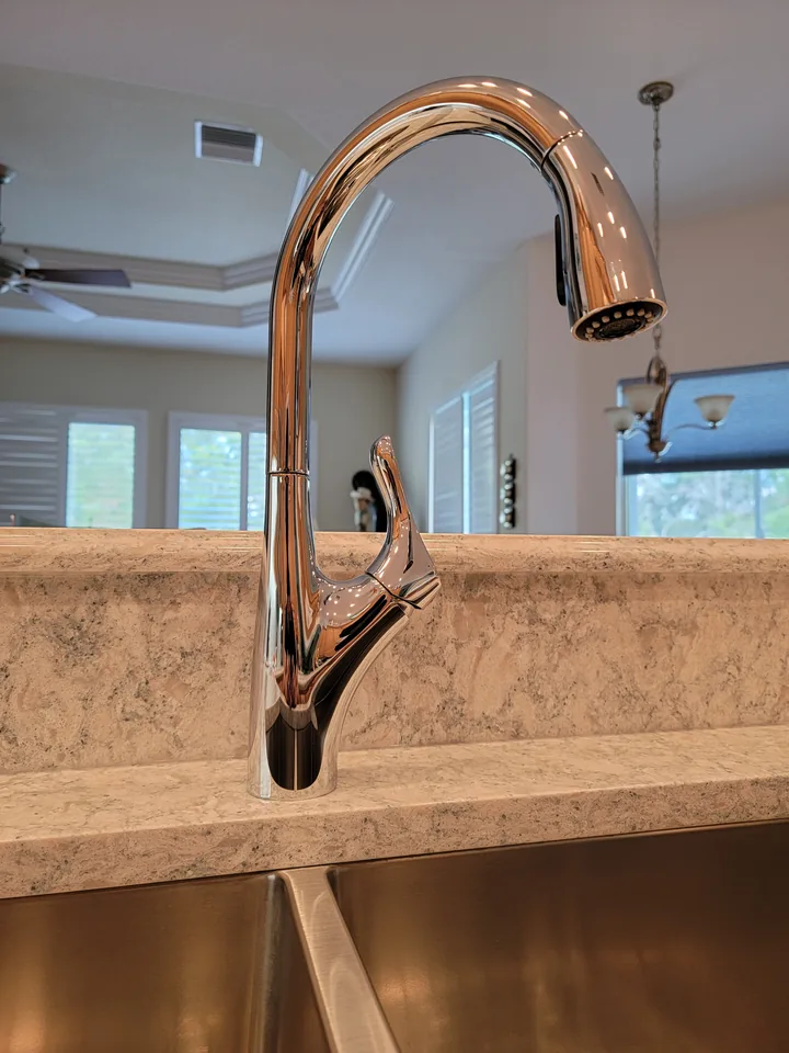Polished kitchen faucet with Cambria Montgomery countertop and backsplash