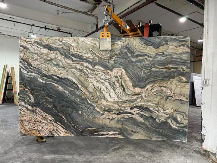 Dramatic green, cream and charcoal granite slab