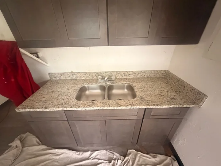 Speckled stone countertop with double sink in Brandon