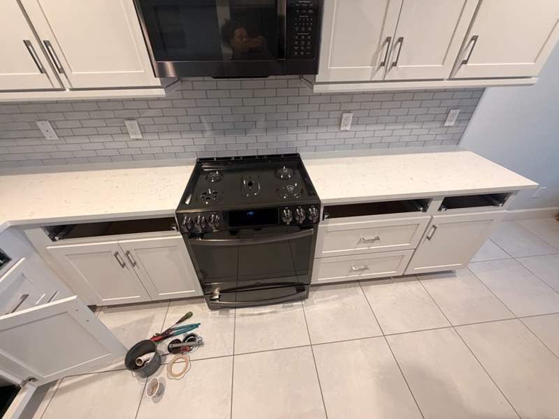 Light kitchen countertops around range in Brandon
