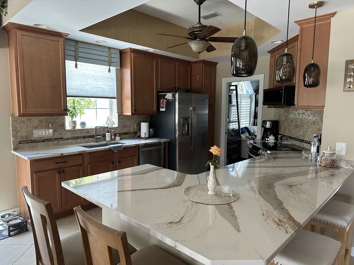 Natural stone kitchen island and perimeter countertops
