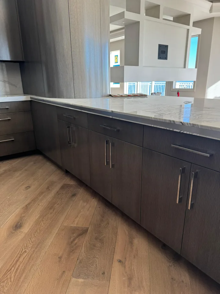 Long stone countertop over dark cabinets in Palm Harbor