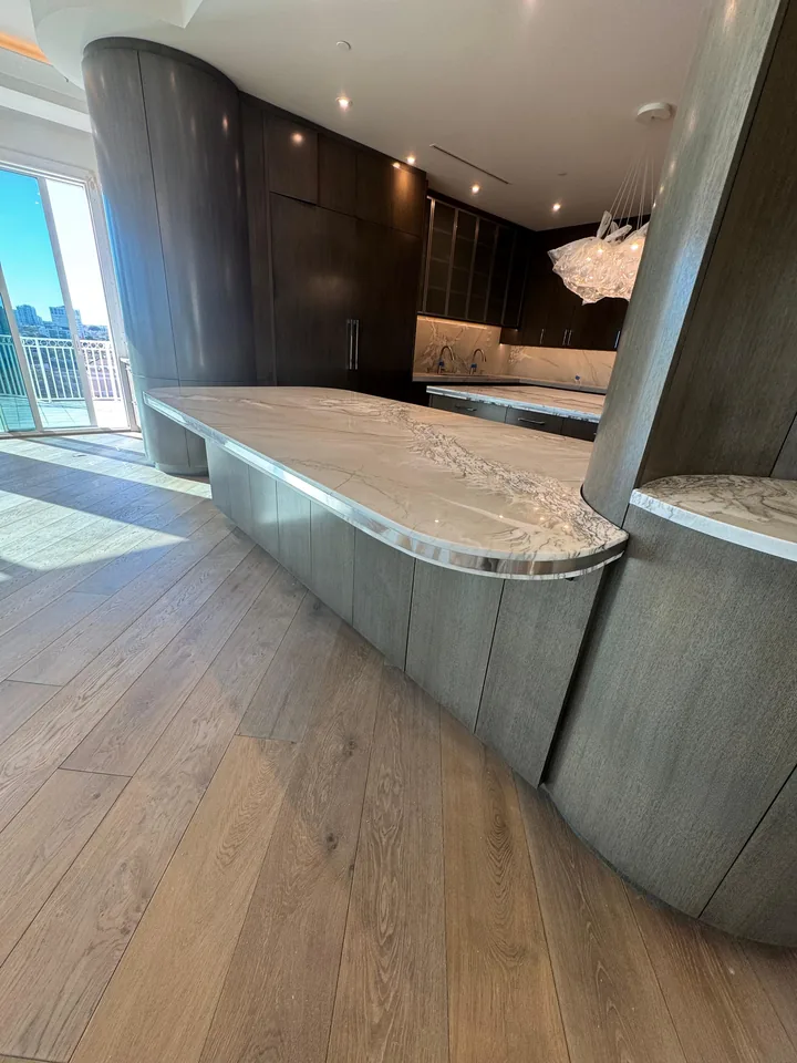 Stone peninsula and dark cabinetry in Palm Harbor