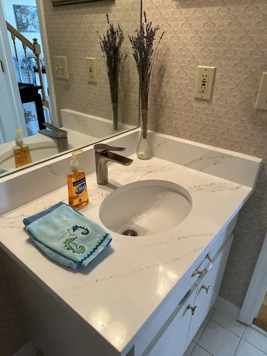 White quartz bathroom vanity with undermount sink