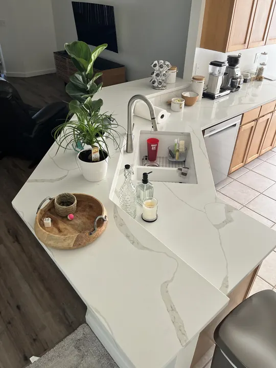 White quartz high bar countertop with undermount sink
