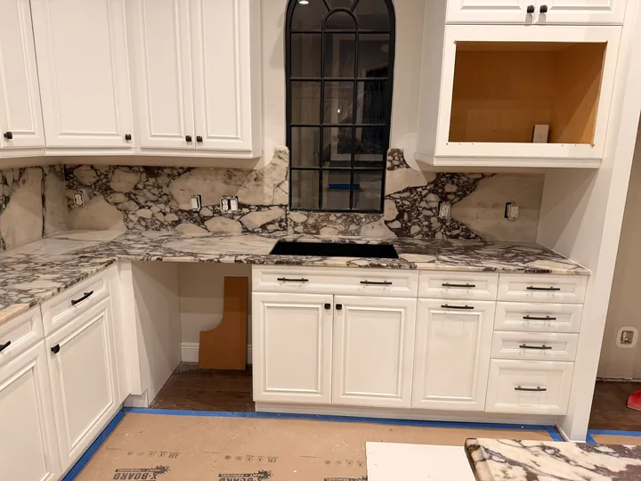 Kitchen counter beneath arched window in Riverview