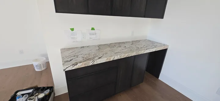 Veined countertop over dark cabinets in St. Petersburg