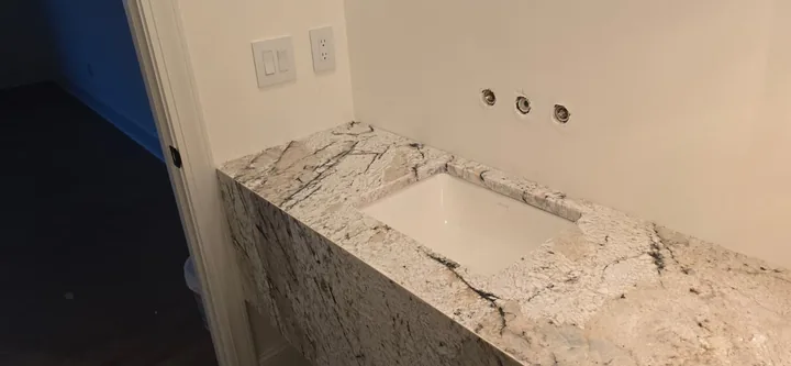 Veined vanity countertop with undermount sink in St. Petersburg