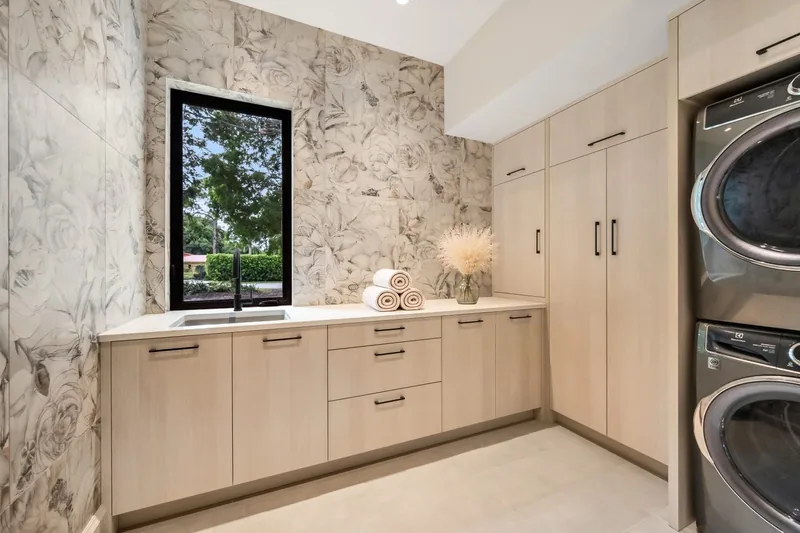 Laundry room with pale stone countertop